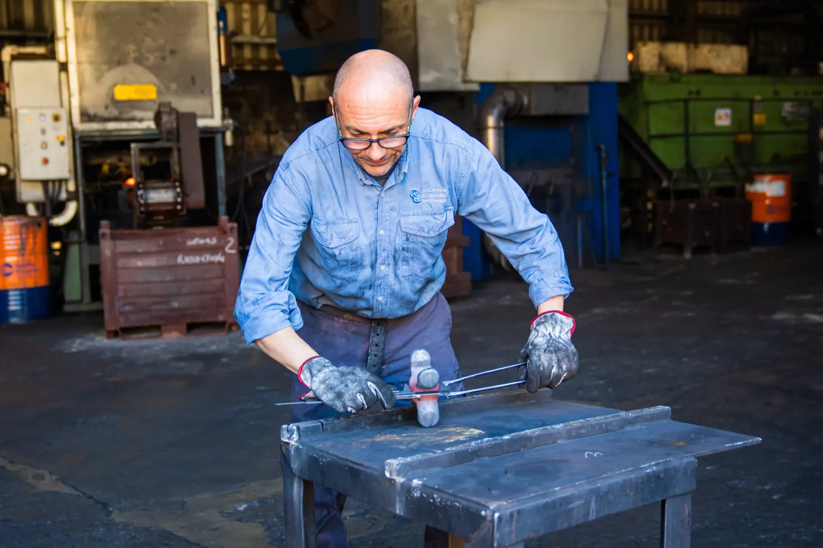 Operator checking a part on the bench
